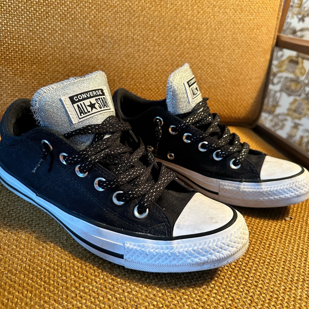 Black and glittery silver converse